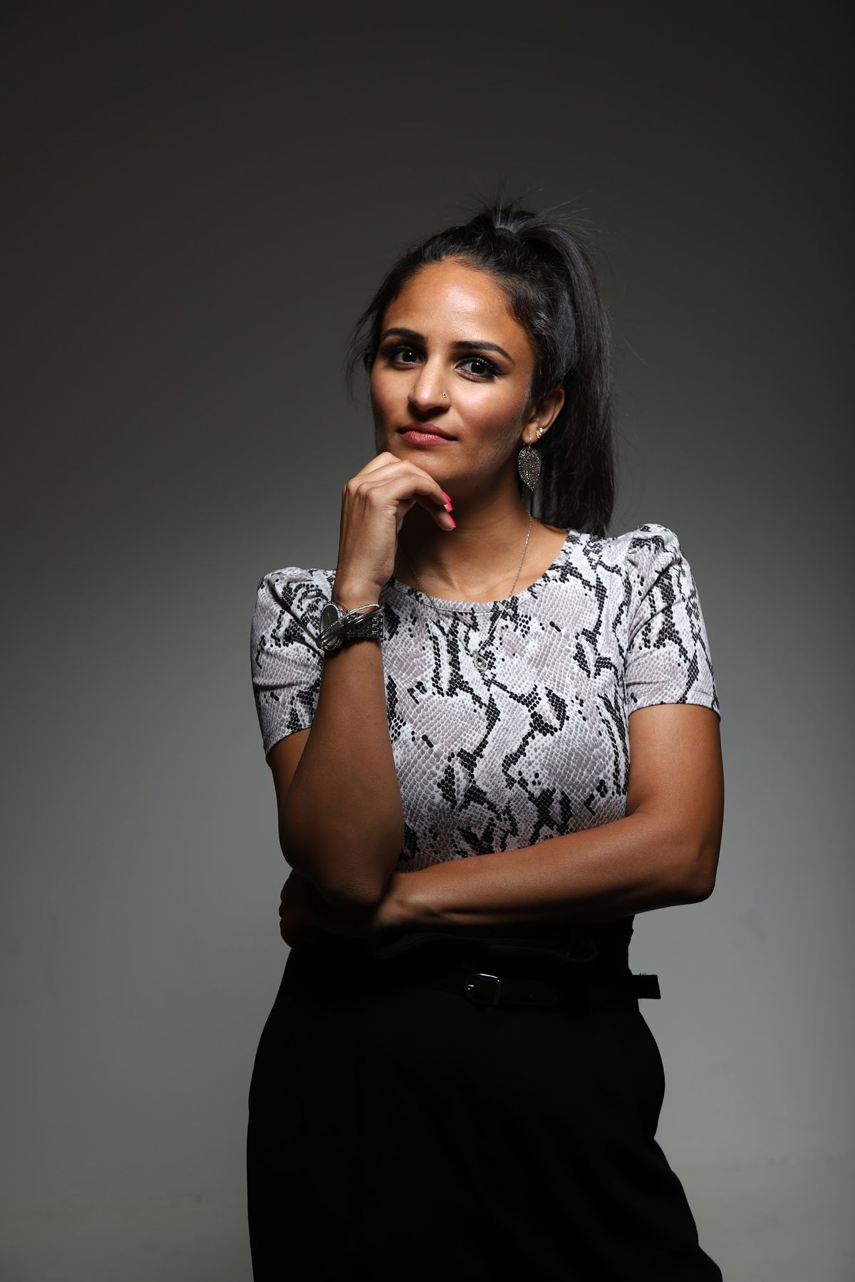 Taniya Refai in a thoughtful studio portrait